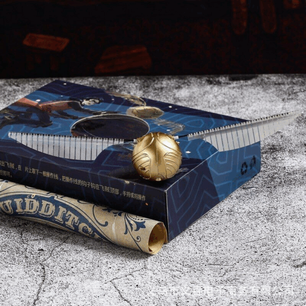 harry potter flying golden snitch flapping wings ball controlled by rope